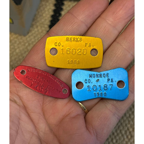 T27. 3 mixed aluminum dog tags