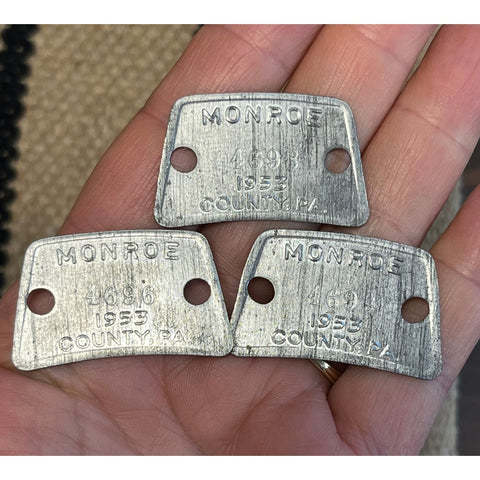 T29. 3 steel dog tags from 1953